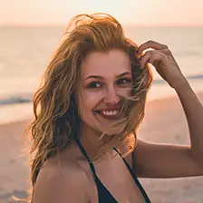 portrait of the face of a smiling Cardi B