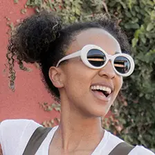 portrait of the face of a smiling Cardi B